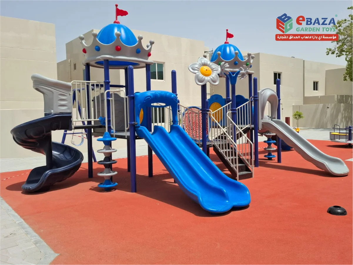 Playground installation at KFUPM Dhahran by Ebaza Gardens, featuring slides, climbers, spring riders, and EPDM safety flooring for campus housing.