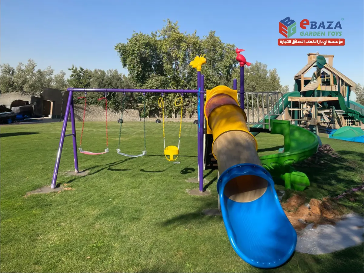 Villa playground project in Dammam featuring spiral slide, tunnel slide, and swing set installation by Ebaza Gardens for private gardens.