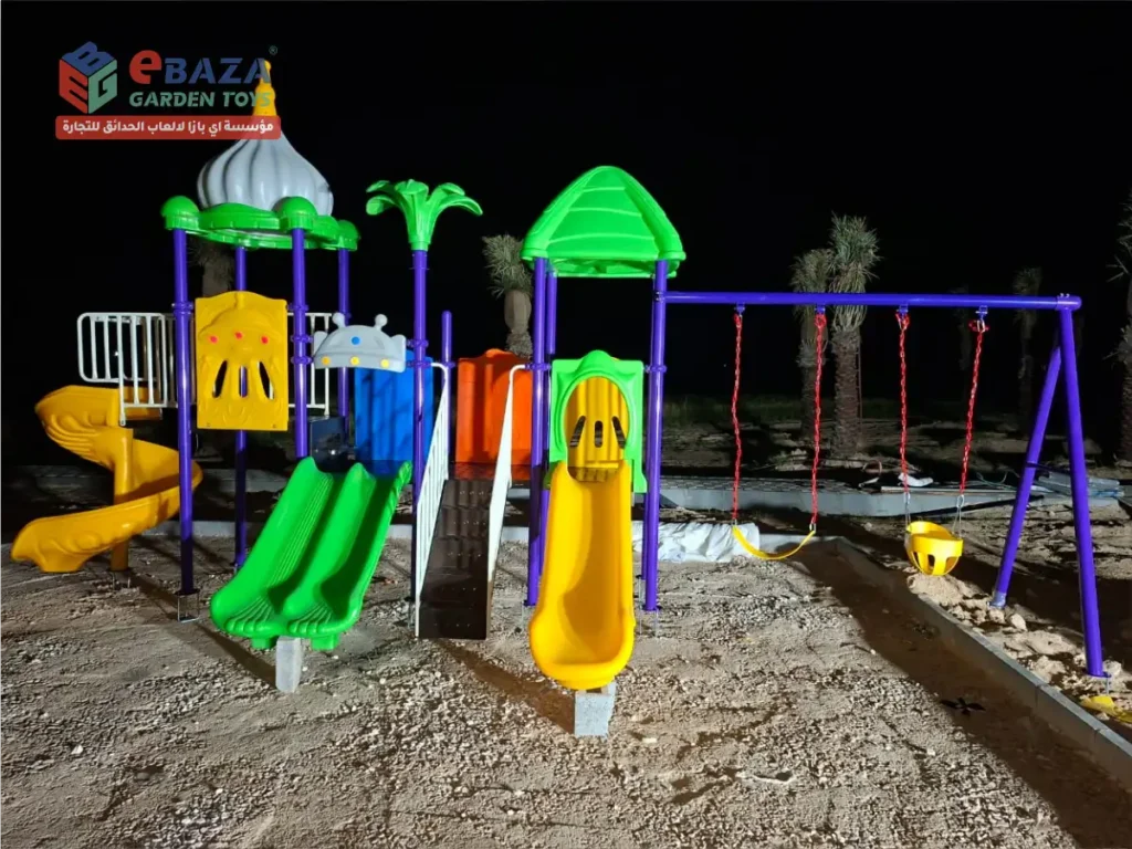 Multi-play outdoor playground featuring spiral slide, double slide, and swing system installed in Abqaiq, Saudi Arabia.