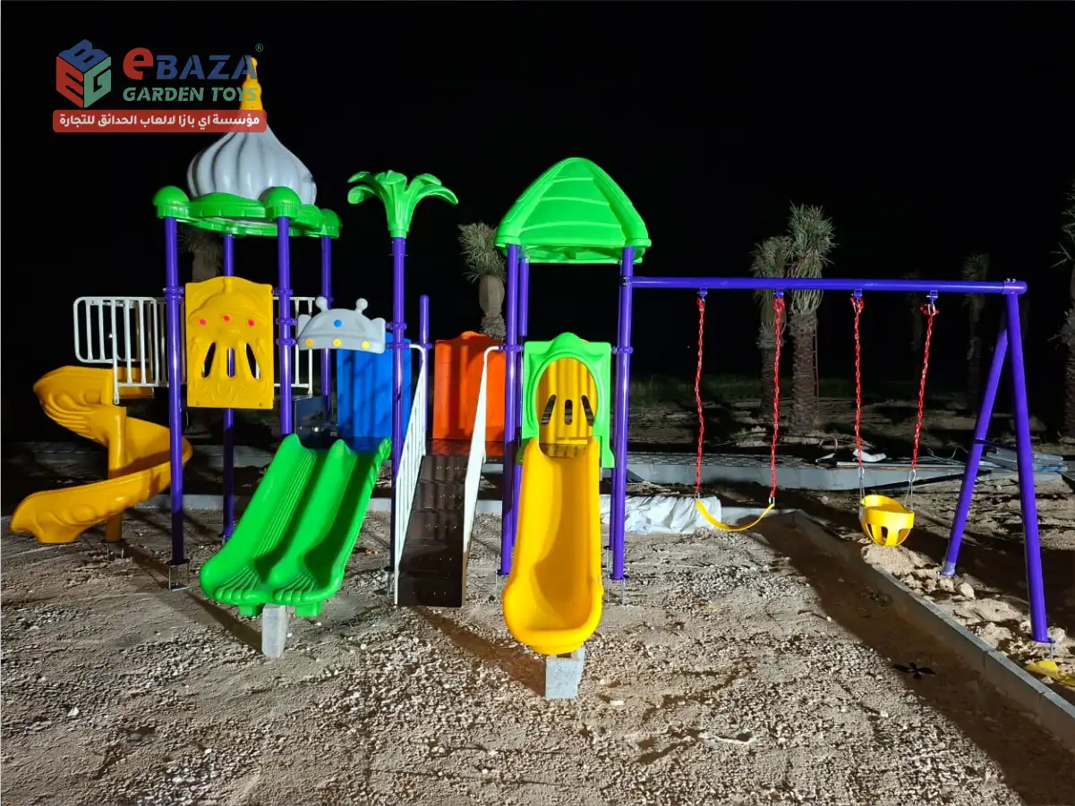 Multi-play outdoor playground featuring spiral slide, double slide, and swing system installed in Abqaiq, Saudi Arabia.