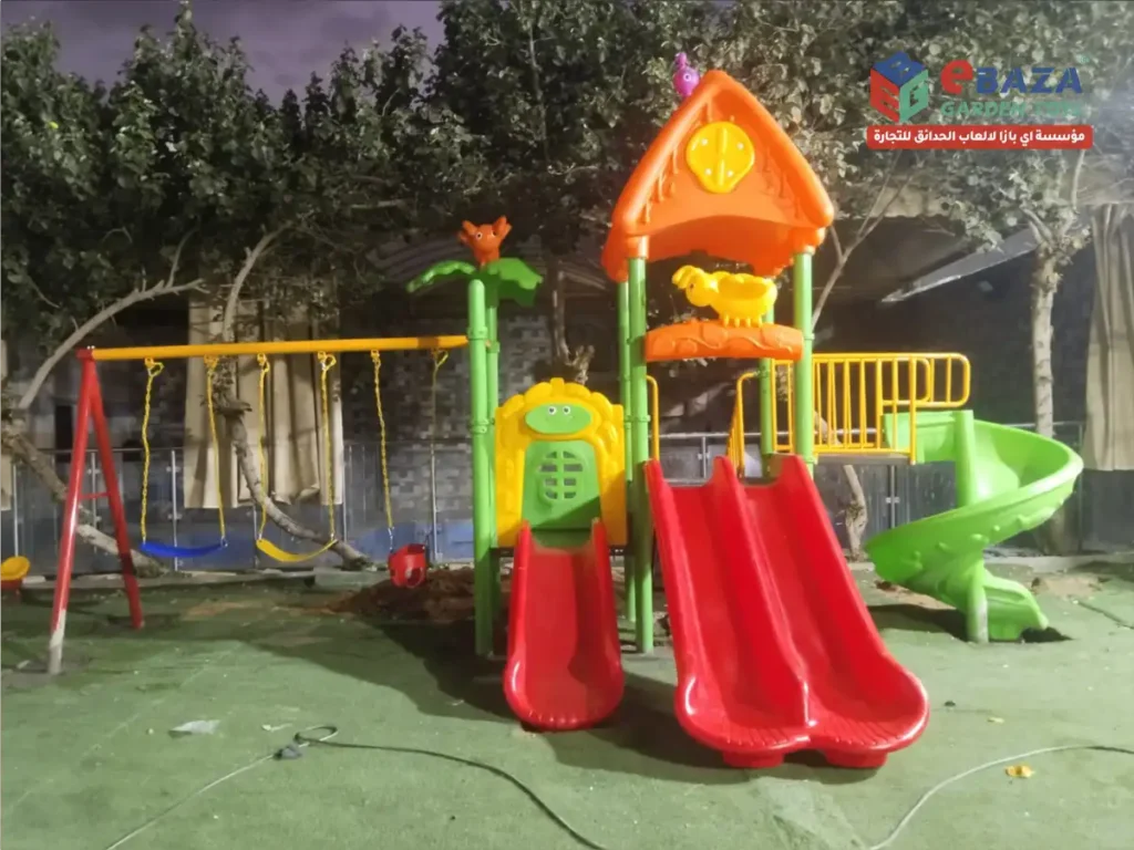 Outdoor playground installation at Al Asayel Chalets Riyadh by Ebaza Garden Toys featuring slides, swings, and galvanized steel structure.