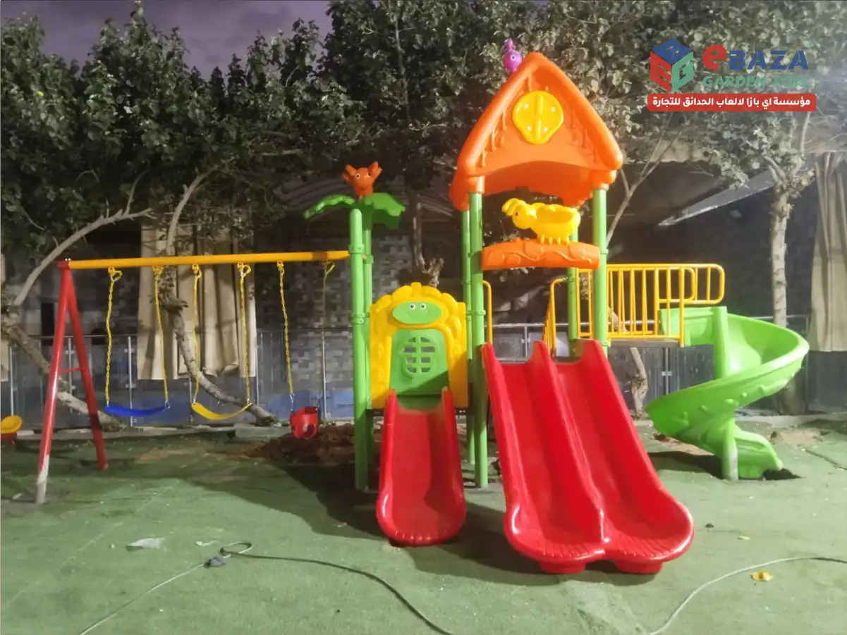 Outdoor playground installation at Al Asayel Chalets Riyadh by Ebaza Garden Toys featuring slides, swings, and galvanized steel structure.