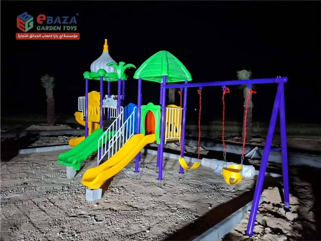 Multi-play outdoor playground featuring spiral slide, double slide, and swing system installed in Abqaiq, Saudi Arabia.