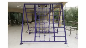 Purple outdoor climbing frame with rope net and ladder sections installed on a villa patio for children’s active play.