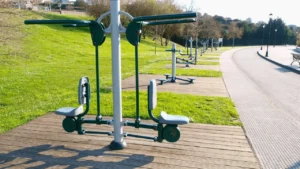 Outdoor chest press exercise machine installed in a public park fitness area