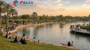 Salam Park in Riyadh with large lake, green lawns, walking paths, palm trees, Saudi families, and a small boat on the water.