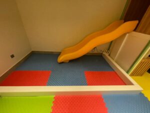 Indoor kids slide with colorful soft foam mats for a safe play area in Saudi homes, nurseries, and indoor playgrounds