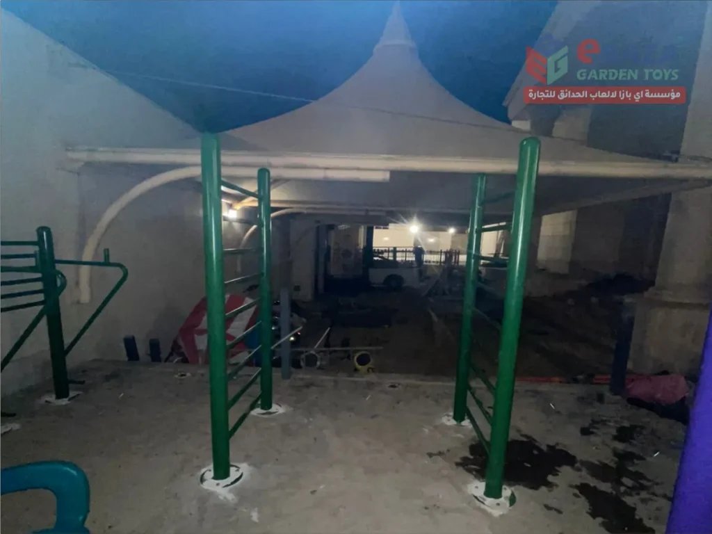 Outdoor climbing frame installed in Al Khobar with green steel posts and concrete anchoring