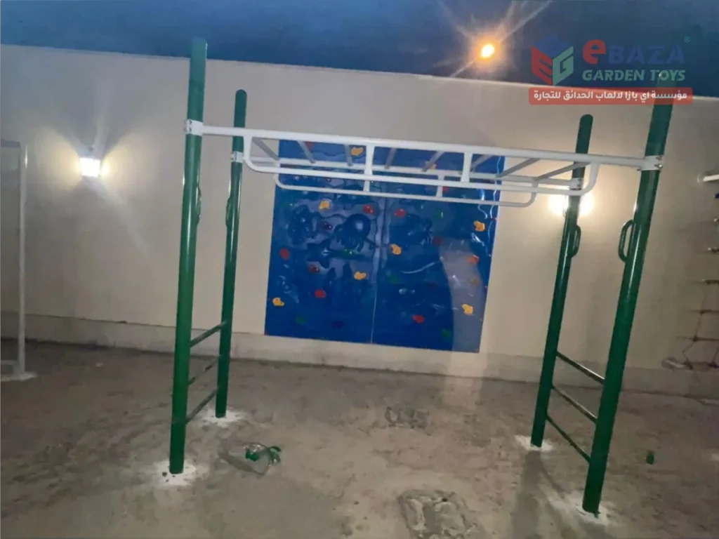 Monkey bar installation in Al Khobar outdoor play area with steel posts fixed into concrete