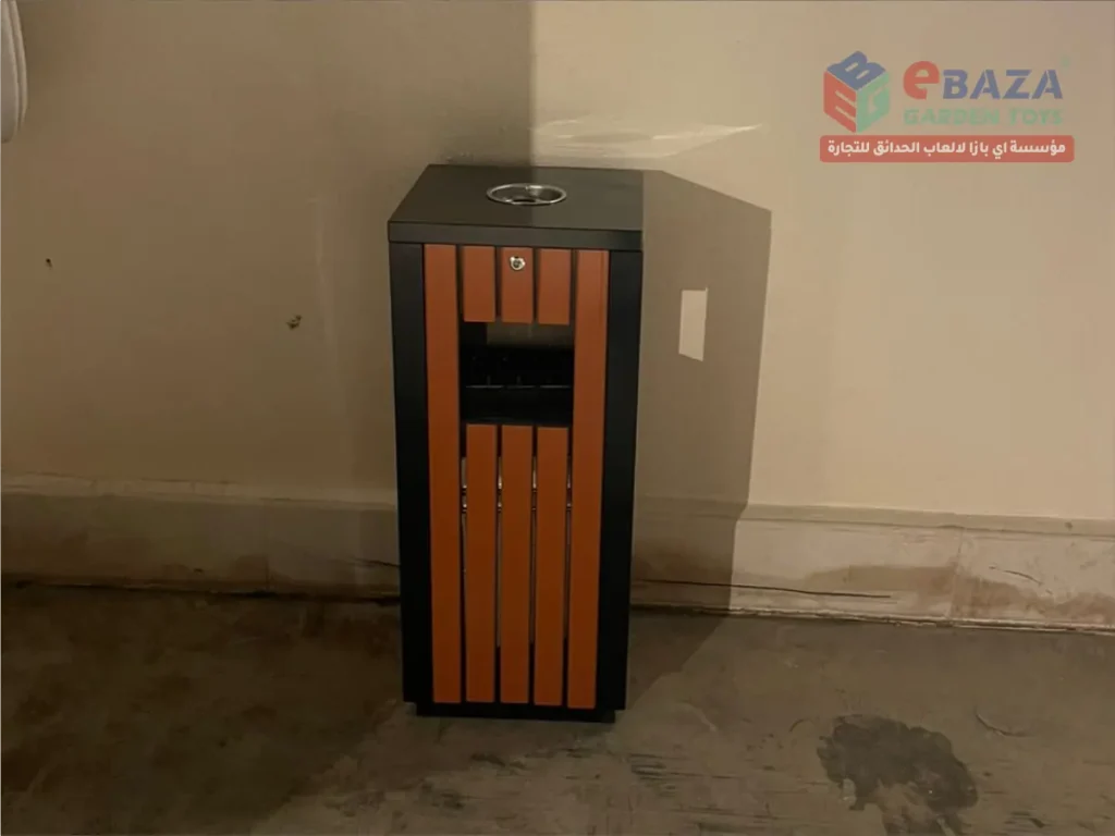 Outdoor dustbin with wooden-style panels and metal frame installed in Hail by Ebaza Garden Toys.