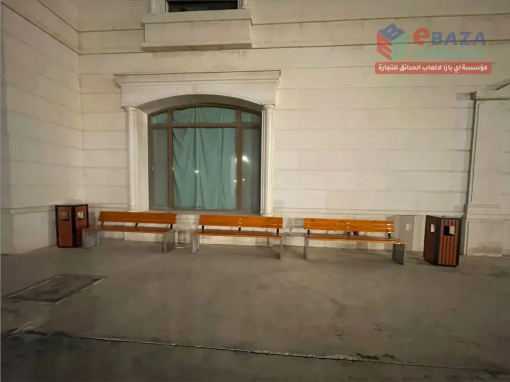 Outdoor seating area with wooden benches and dustbins installed by Ebaza Garden Toys in Saudi Arabia.
