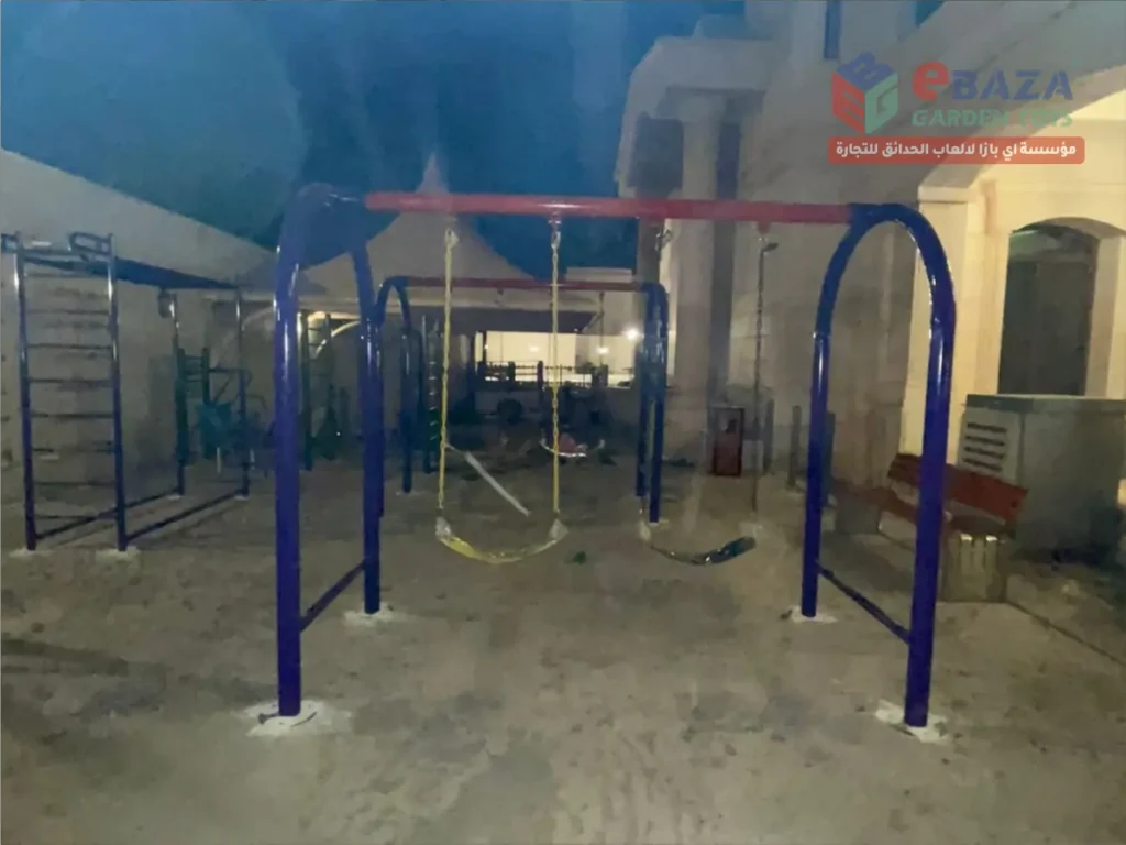 Outdoor swing set installed in Al Khobar with steel frame and concrete fixing