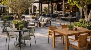 Outdoor restaurant and café furniture with wooden tables, powder-coated steel chairs, aluminum and steel frame seating, and teak wood-style garden furniture.