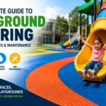 Colorful rubber playground flooring installed under children's playground equipment in Saudi Arabia for enhanced fall protection and safety.