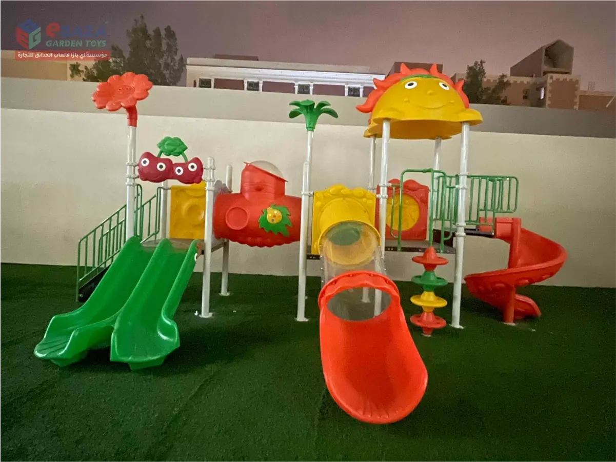 Outdoor playground installation in Riyadh with double slides, tube slide, spiral slide, and elevated play platforms.