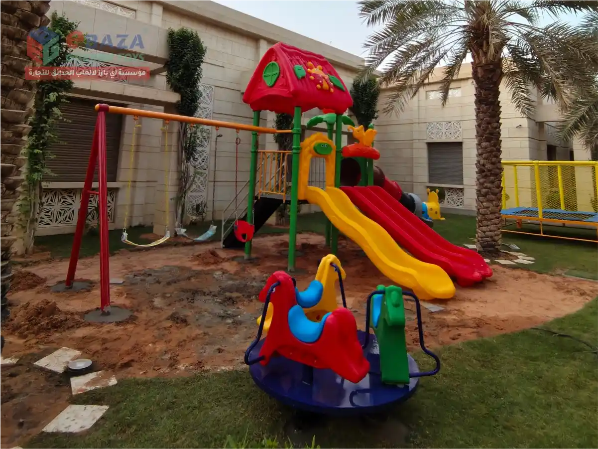 Residential outdoor playground in Riyadh with multi-activity playset, slides, swings and merry-go-round installed by Ebaza Gardens.