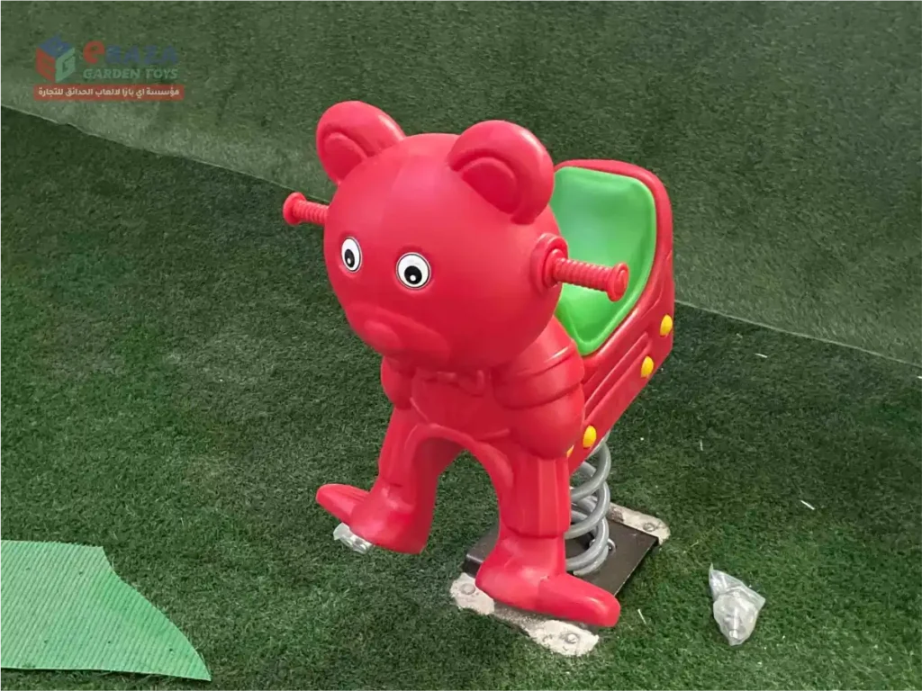 Red bear spring rider installed in a children’s playground in Riyadh.