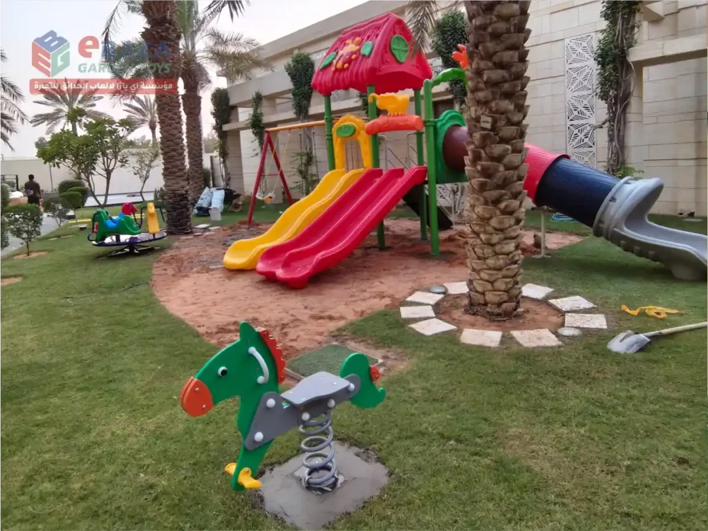 Horse spring rider with multi-activity playground, slides and swings installed in a residential garden in Riyadh by Ebaza Gardens.
