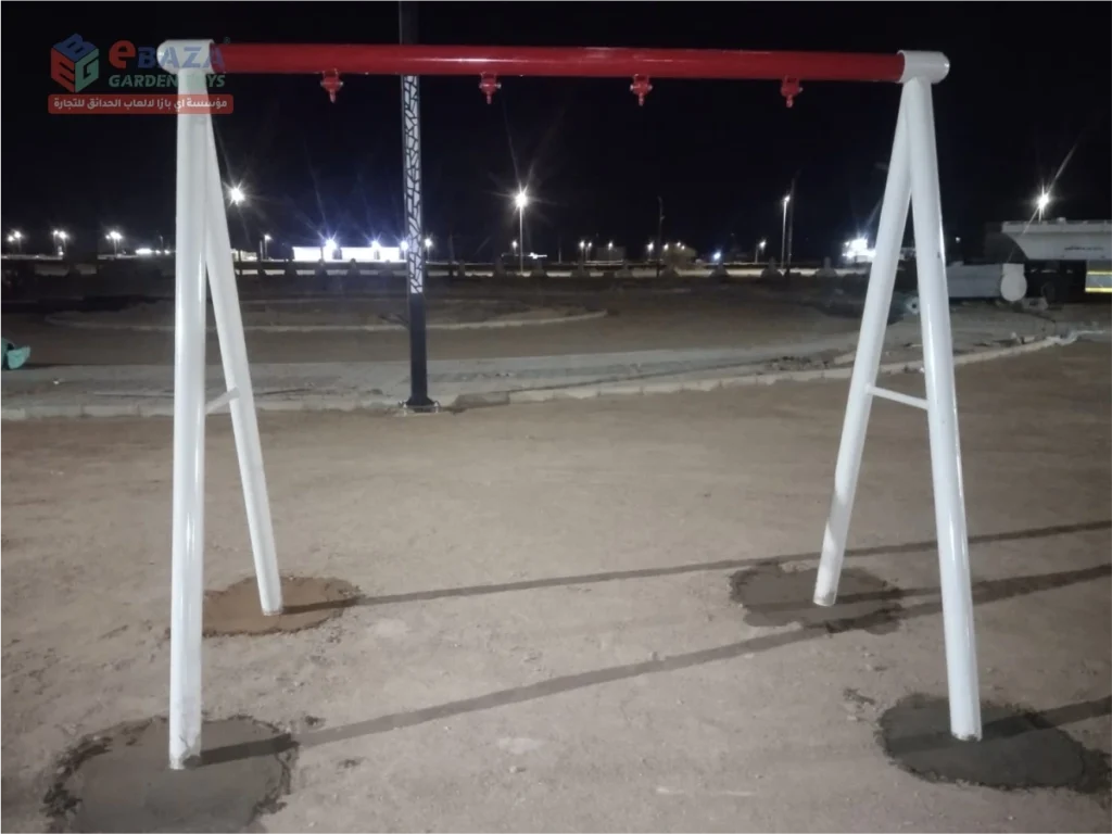 Two-seat A-frame swing structure with four suspension points installed in a Madina public park.