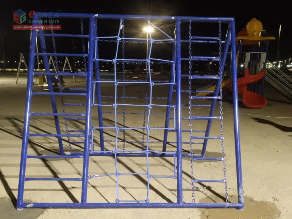 Blue multi-activity climbing frame with side ladders and chain climbing net installed in a Madina public park.