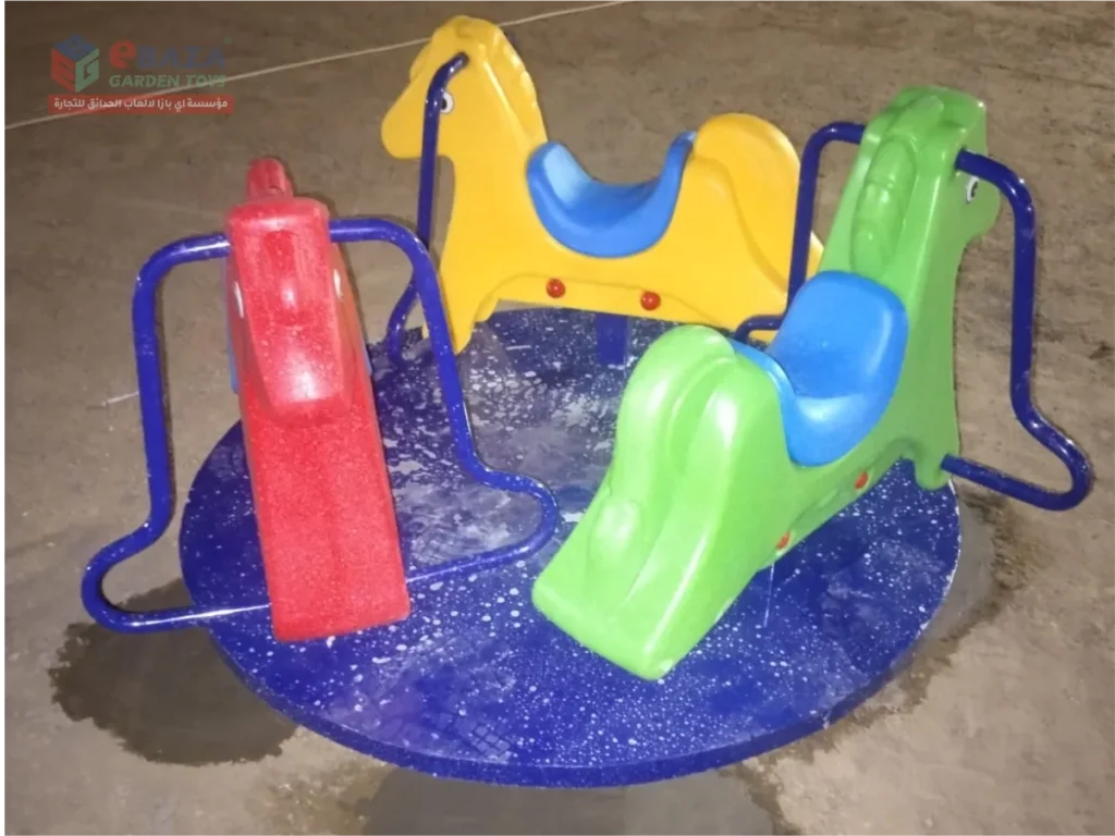 Colorful animal-themed playground merry-go-round with multiple seats installed in a public park in Madina.