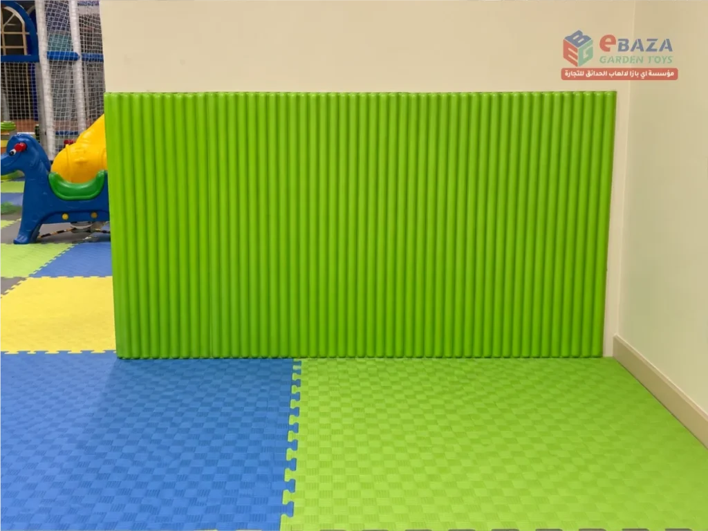 Green protective wall padding at Alfanar indoor playground in Riyadh.