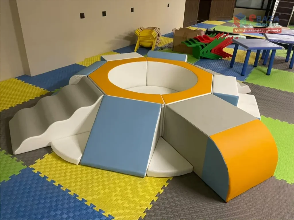 Modular soft play equipment with padded ramps and steps at Alfanar indoor playground in Riyadh.