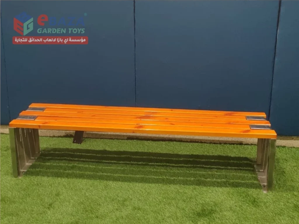 Outdoor wooden bench with metal legs installed at Beech Hall School Riyadh playground area.