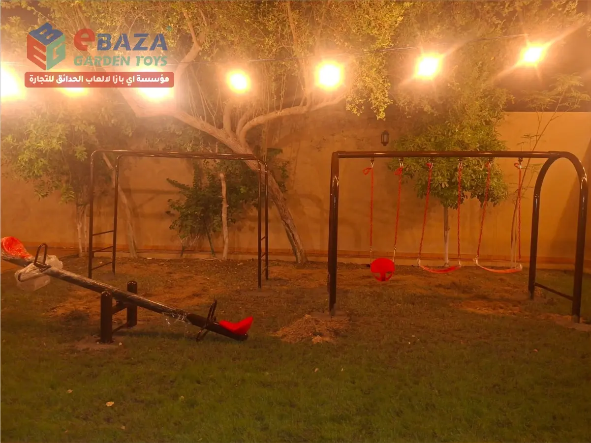 Villa playground installation in Al Nuzha, Dammam with swings, seesaw and outdoor climbing equipment in a private garden.